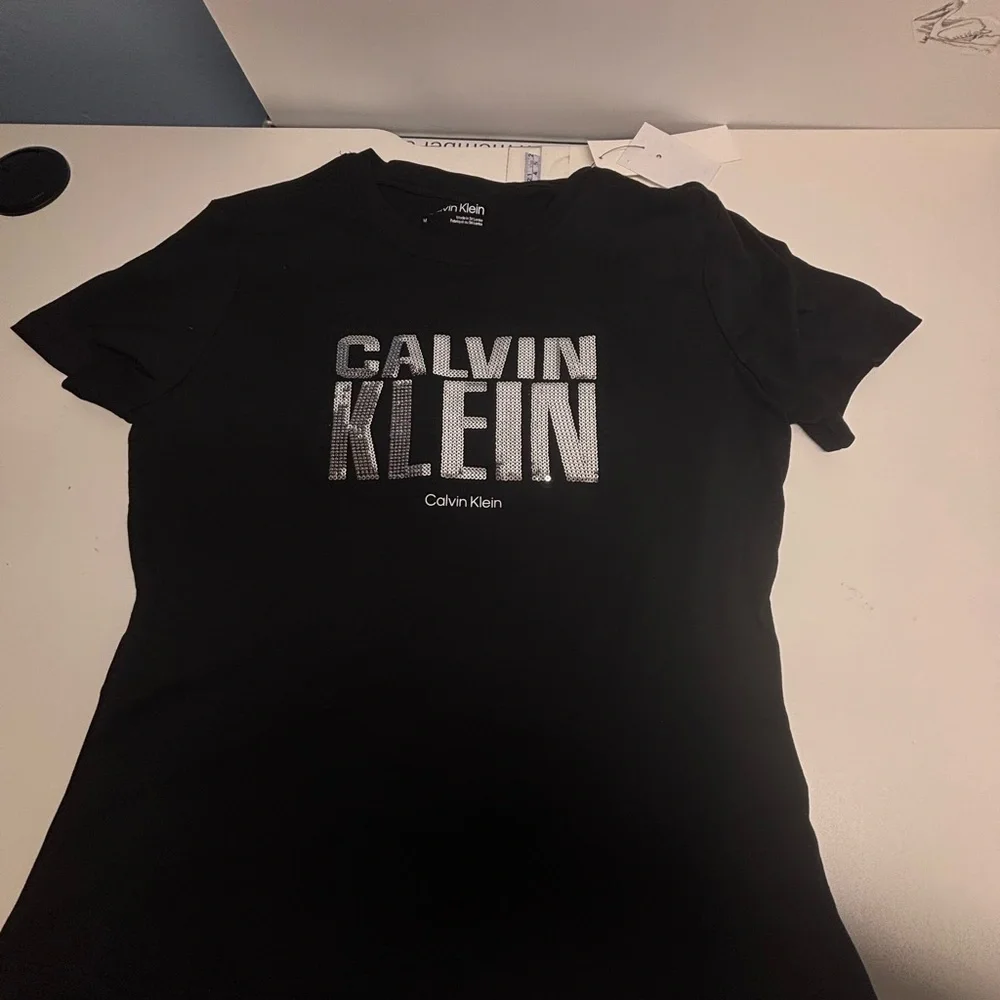 NWT Calvin Klein Black Tee with Silver Logo Print - Picture 2 of 8